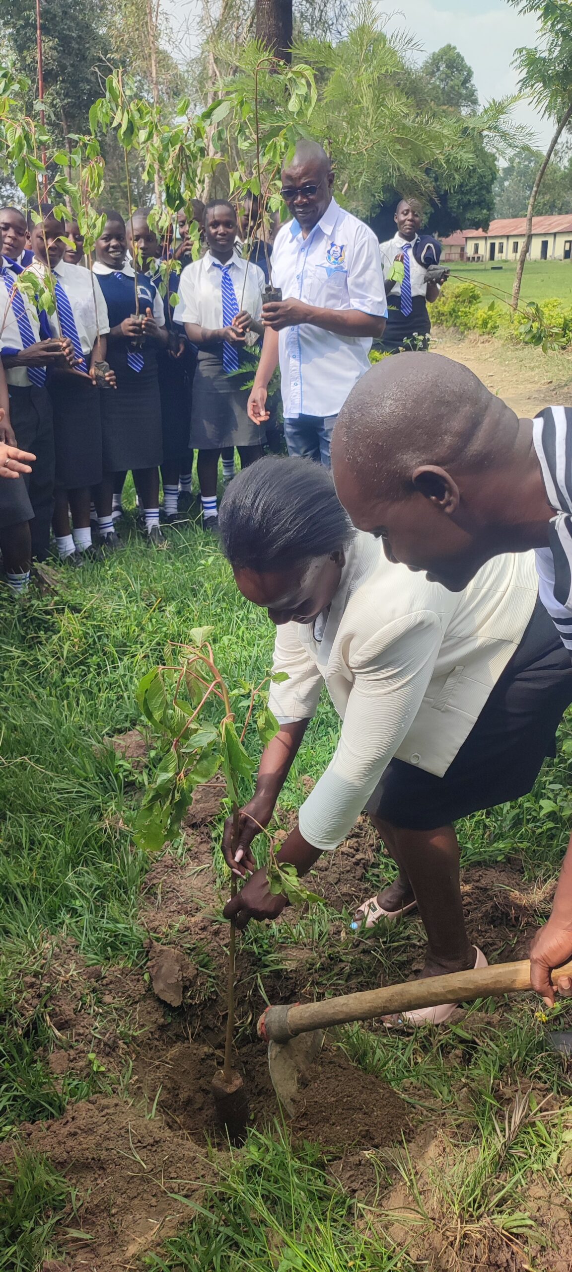 Ambassador Naomi Nancy Nakhumicha HSC, OGW planting trees at ACK Namulungu secondary